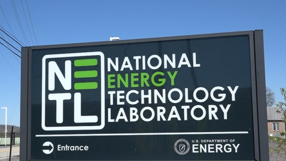 National Energy Technology Laboratory sign displayed outdoors under a clear sky.