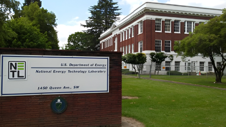 National Energy Technology Laboratory building and sign on a green campus.